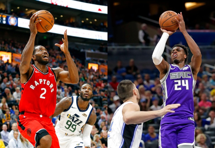 Sacramento Kings' Buddy Hield makes a shot over Orlando Magic's Nikola Vucevic during an NBA game