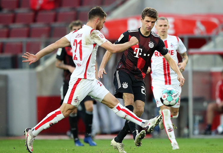 Thomas Muller scores the opening goal for Bayern Munich in the Bundesliga match against Koln