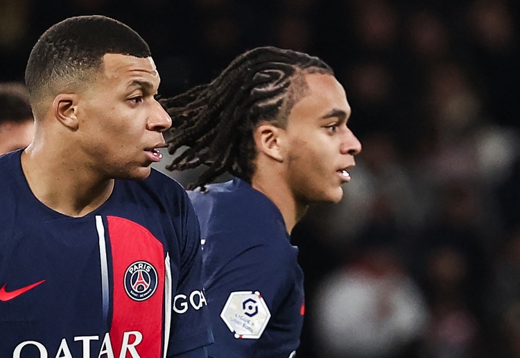 Ethan Mbappe joins his brother, Kylian, on the pitch during PSG's Ligue 1 game against Metz