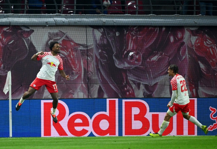 Lois Openda celebrates scoring during RB Leipzig's Bundesliga game with Bayer Leverkusen