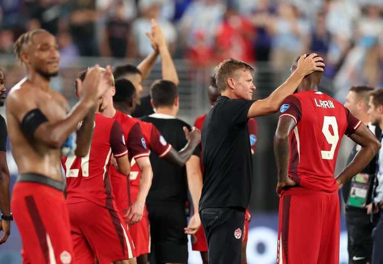 Canada head coach Jesse Marsch consoles his players after losing to Argentina in the 2024 Copa America semi-final match